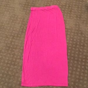 A tight pink skirt with a beautiful pop of color